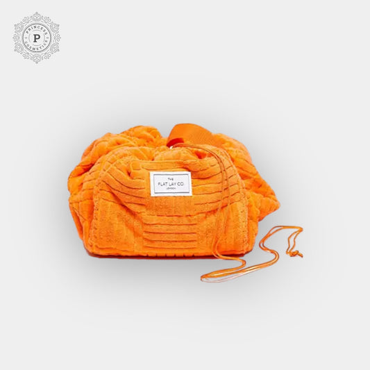 The Flat Lay Co. Drawstring Bag - Orange Towel. ذا فلات لاي كو. حقيبة برباط - منشفة برتقالية - Princess Cosmetics Qatar